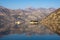 Mountains and two islands of Our Lady of the Rocks and St. George are reflected in Kotor Bay on sunny winter day. Montenegro