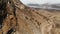 The mountains of Upper Balkaria. Aerial view of the gorge with a dirt road and a low clouds in the mountains of the