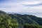 Mountains and valleys covered in coastal live oak trees and other evergreen shrubs, San Simeon, California