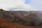 The mountains and valleys of Waimea Canyon on a partially cloudy day in Kauai, Hawaii