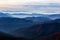 Mountains View with many stacked foggy ranges and bird