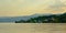 Mountains and village on the embankments of river Danube, Romania in early morning light