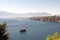 Mountains and a yatch in the sea.