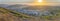 Mountainside residential area in San Diego, California against the sunset in the sky