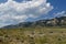 Mountainside view with thick cotton clouds in the skies along North Fork Highway in Wyoming