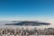 Mountainsides of the Beskydy region in the Czech Republic are sinking into a thick white inversion rising from the cities. Winter