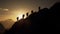 mountaintop climbers\\\' silhouettes exemplify success that can be achieved through teamwork