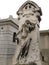 Mourninag sculpture of a woman above a tomb in the Pere Lachaise cemetery. All Saints Day, November 1, Day of the Dead, Dia de