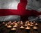 Mourning candles burning on England national flag of background. Memorial weekend, patriot veterans day, National Day of Service