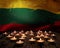 Mourning candles burning on Lithuania national flag of background. Memorial weekend, patriot veterans day, National Day of Service