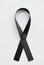 Mourning ribbon on white background