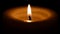 Mourning sad burning candle on a black background