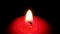 Mourning sad burning candle on a black background