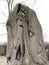 Mourning sculpture of two women dressed in capes in the Pere Lachaise cemetery. All Saints Day, November 1, Day of the Dead, Dia