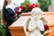 Mourning Woman at Funeral with coffin