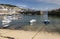 Mousehole Harbour Cornwall with St Michael\'s Mount in distance