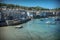 Mousehole harbour on a summer day Cornwall England