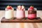 mousse trio of chocolate, vanilla, and strawberry in glass jars