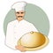 Moustached chef with a kitchen hat carrying a covered tray