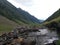 Moutain and valley skyline with water pond and rocks