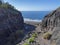 Mouth of Barranco de Guigui Grande gorge with view of empty sand beach Playa de Guigui in west part of the Gran Canaria