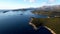 Mouth of the Bay of Kotor with the island of Mamula and green mountain ranges. Drone