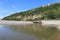 The mouth of the river Axe as it meets the sea at Axmouth in Devon. It is quite narrow and becomes a raging torrent when the tide