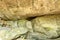 Mouth of a spring, natural fountain, subterranean course of water from big stone in the forest at Op Luang National Park.