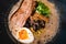 Mouth watering japanese ramen in a bowl served with egg