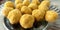 Mouth watering sweet - Besan laddoo made by roasted gram flour, ghee, dry fruits and sugar, served in a plate