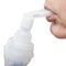 Mouthpiece of jet nebulizer in lips of patient