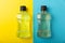 Mouthwash bottles. Rinse for oral hygiene on a yellow-blue background.