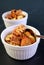 Mouthwatering Banana Walnut Bread Pudding in a White Bowl on Black Table