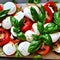 Mouthwatering Caprese salad with ripe tomatoes, fresh mozzarella, and fragrant basil leaves