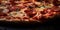 A mouthwatering close-up view of a scrumptious pizza, featuring a perfectly baked crust, melted cheese, and a variety of