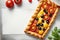 A mouthwatering closeup of a homemade tomato tart - generated ai photos
