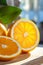 Mouthwatering macro shot of a freshly cut orange, revealing its juicy, vibrant interior as it\\\'s sliced in half. The luscious