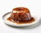 Mouthwatering sticky toffee pudding with caramel on a white background, Generative AI