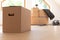 Move. Cardboard boxes for moving into a new, clean home. In a sunny day by a window in attic