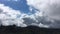 Movement of air masses in the mountains of California. Clouds and cumulus clouds