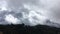 Movement of air masses in the mountains of California. Clouds and cumulus clouds