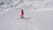 In Movement Beginner Woman Skier Down The Long Turns On The Slope Of A Mountain