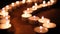 Movement of candle flame in the dark , blowing by the wind , candle wick close up