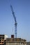 Movement of cargo by a construction crane. The crane materials floor. Construction modern technology monolithic concrete