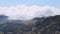 Movement of clouds over the mountain peaks. View from the observation deck of the mausoleum of Negush, Lovcen national Park,