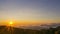 The movement of morning mist on the eastern side saw the orange horizon hitting the sunlight at Doi Inthan, Chiang Mai Province,