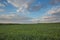 The movement of the thunderclouds over the fields of winter wheat in early spring in the vast steppes of the Don.