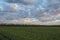 The movement of the thunderclouds over the fields of winter wheat in early spring in the vast steppes of the Don.