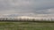 The movement of the thunderclouds over the fields of winter wheat in early spring in the vast steppes of the Don.