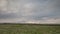 The movement of the thunderclouds over the fields of winter wheat in early spring in the vast steppes of the Don.